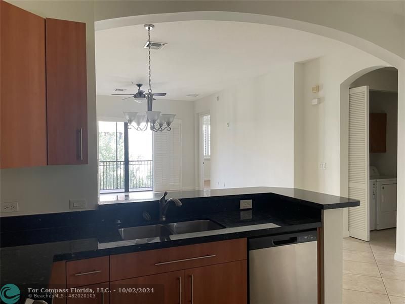 a kitchen with a sink and a window