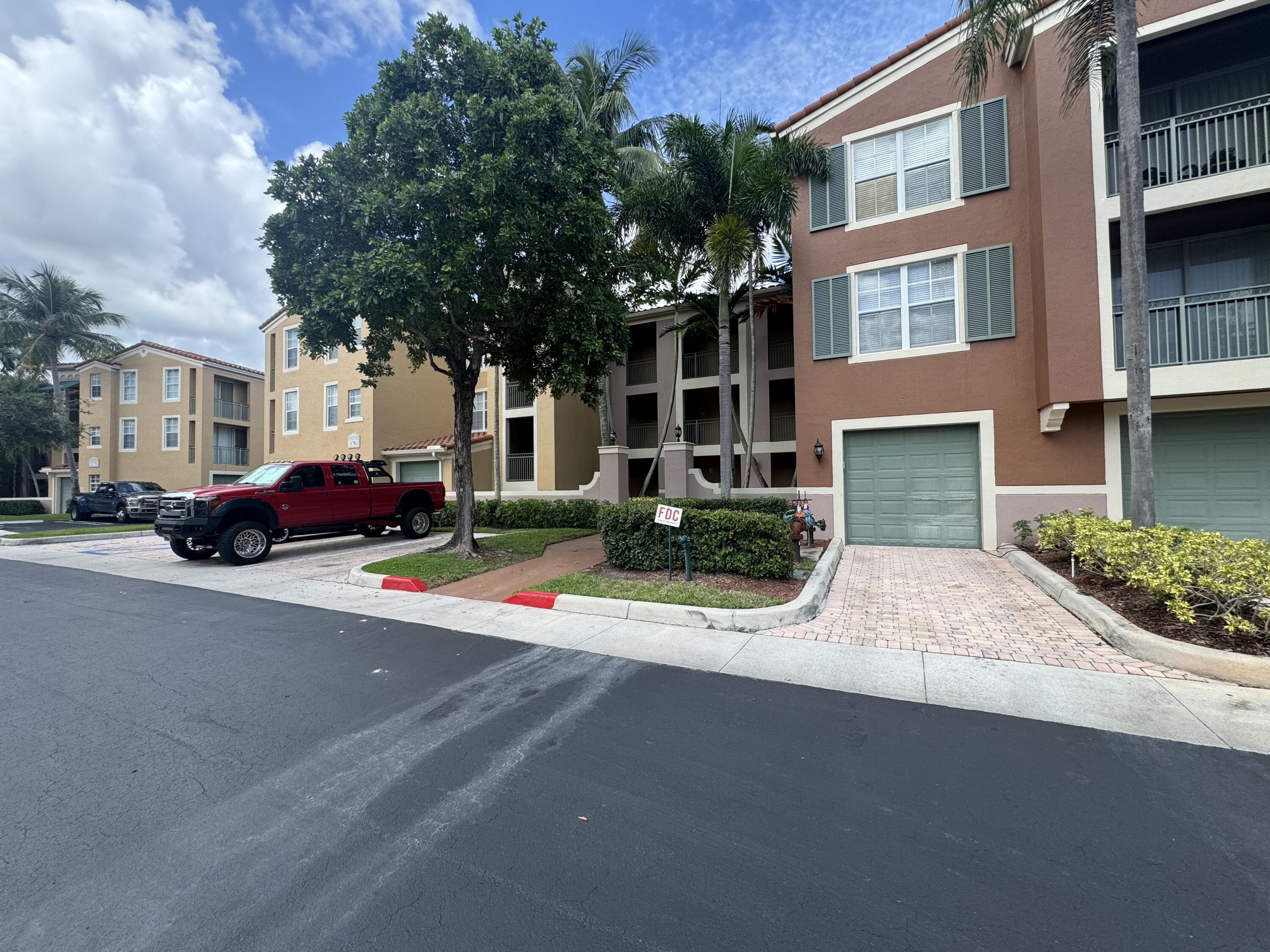 a front view of multiple houses with yard