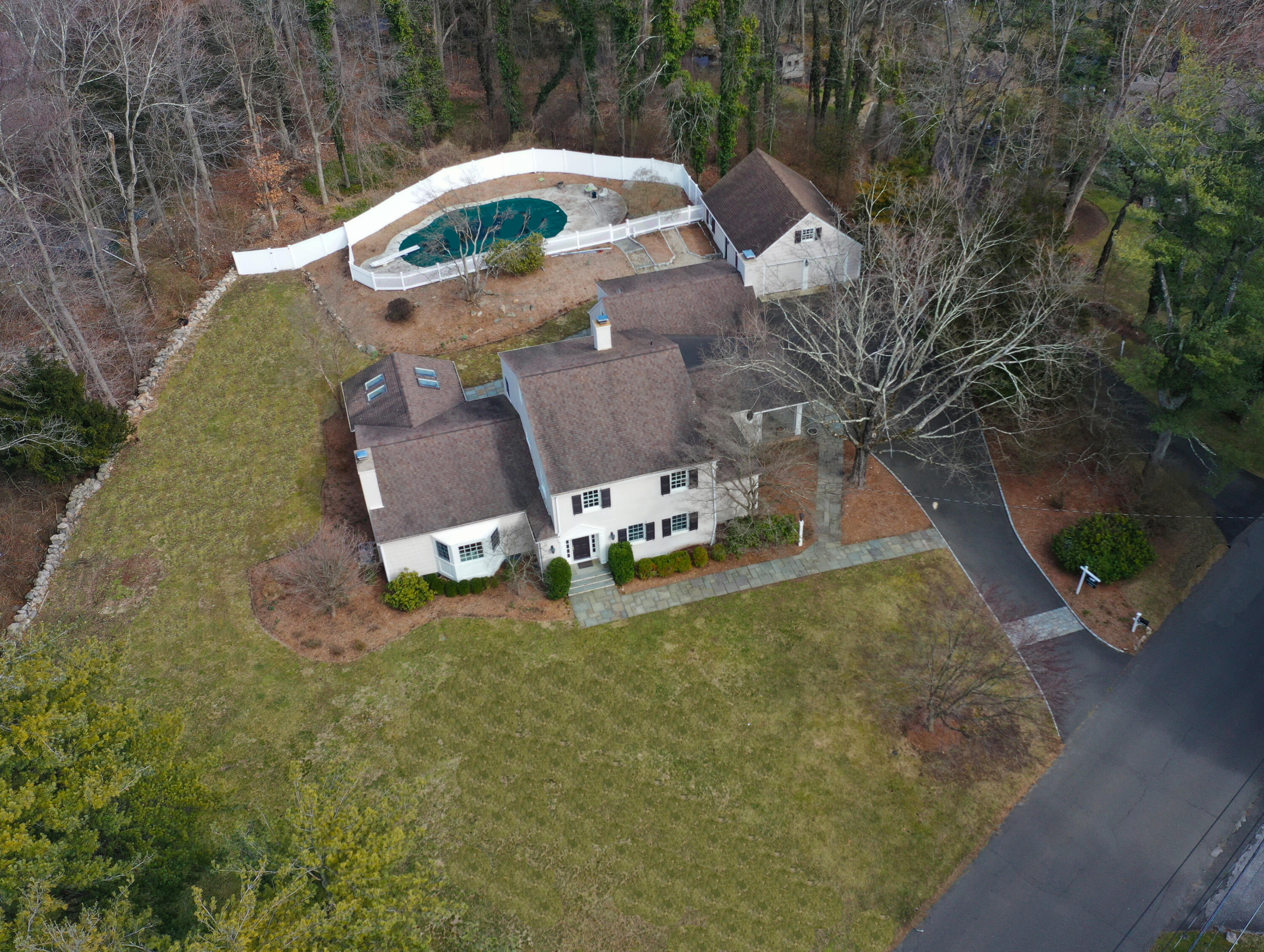 an aerial view of a house with outdoor space