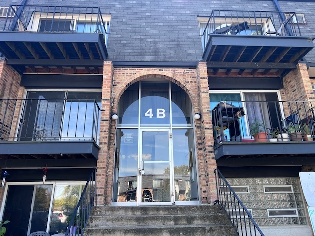 a view of a wooden door of the house