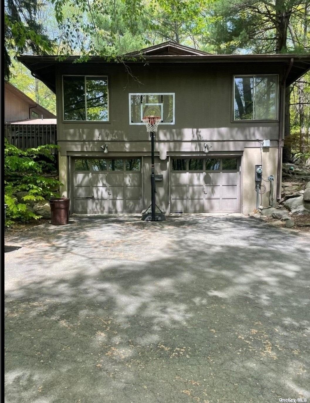 a front view of a house with garage