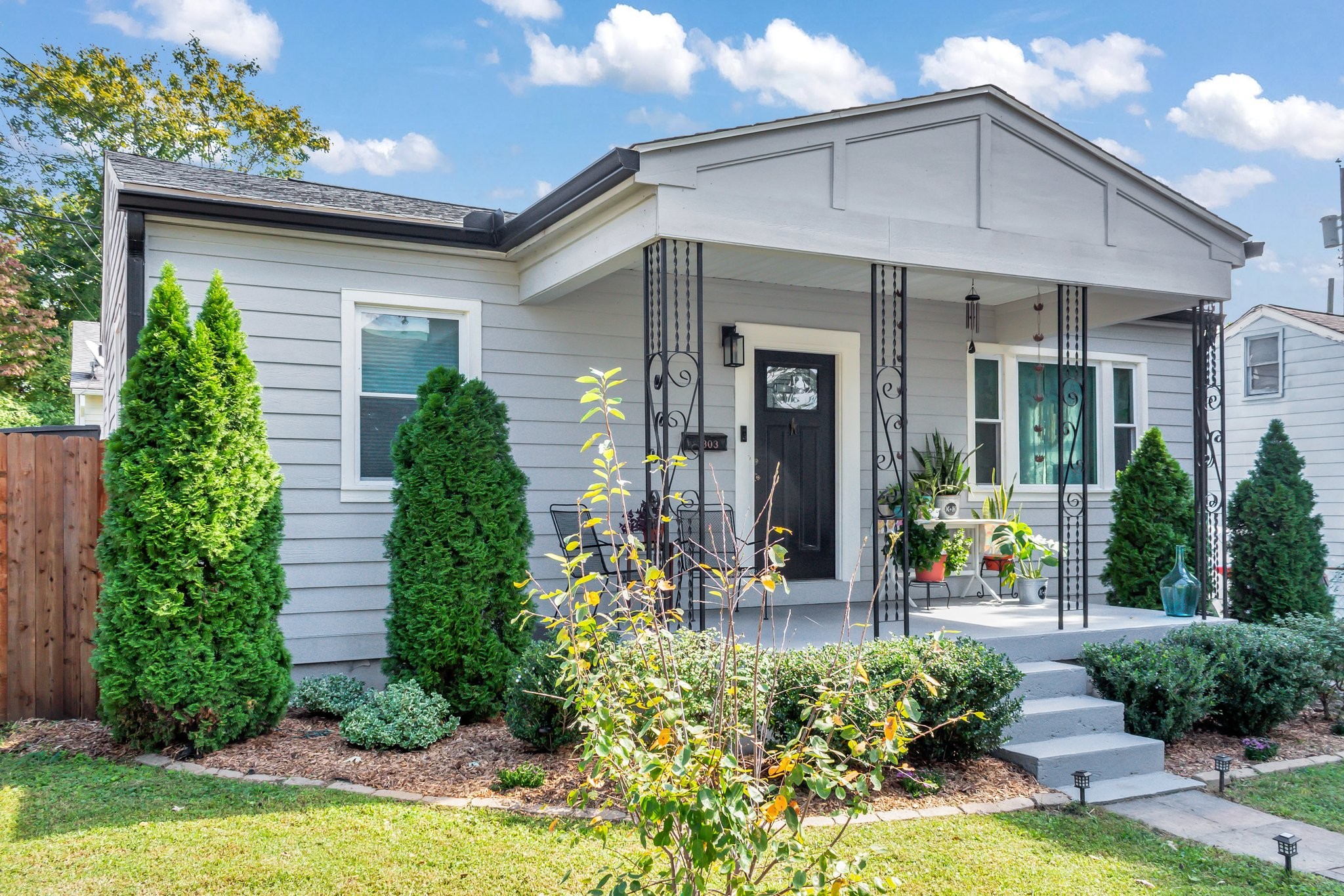 a front view of a house with garden