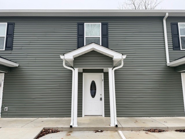 a front view of a house with garage