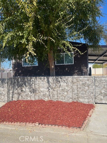 a view of house with a yard