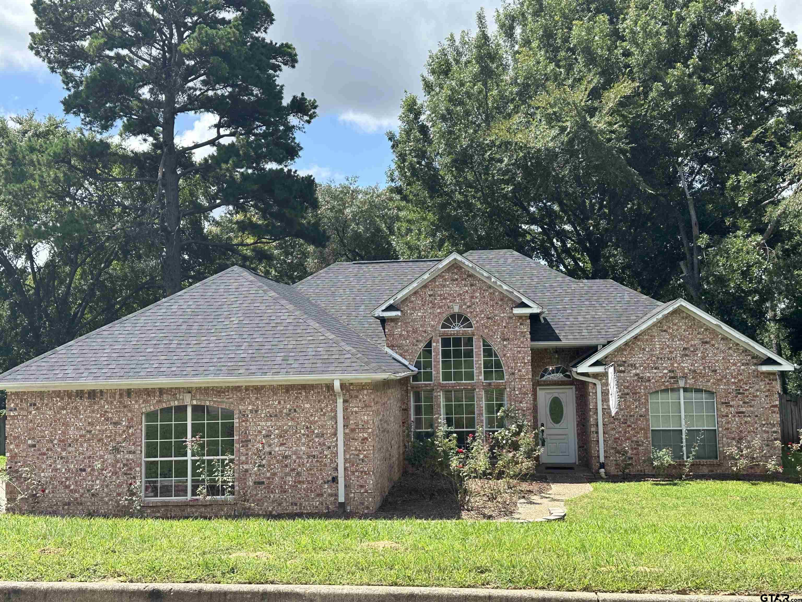 front view of a house with a yard