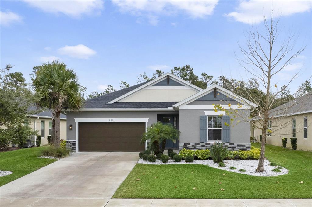 front view of a house with a yard