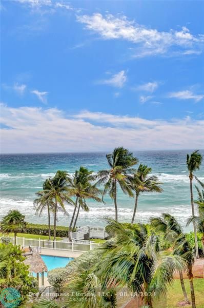 a view of an ocean and a building