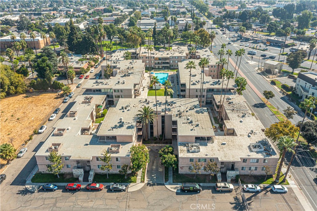 an aerial view of residential houses with outdoor space