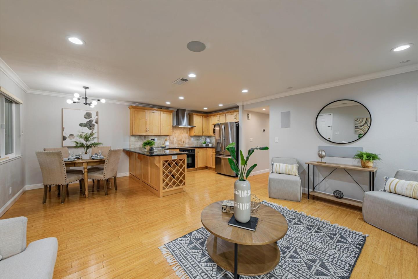 a living room with fireplace furniture and a table