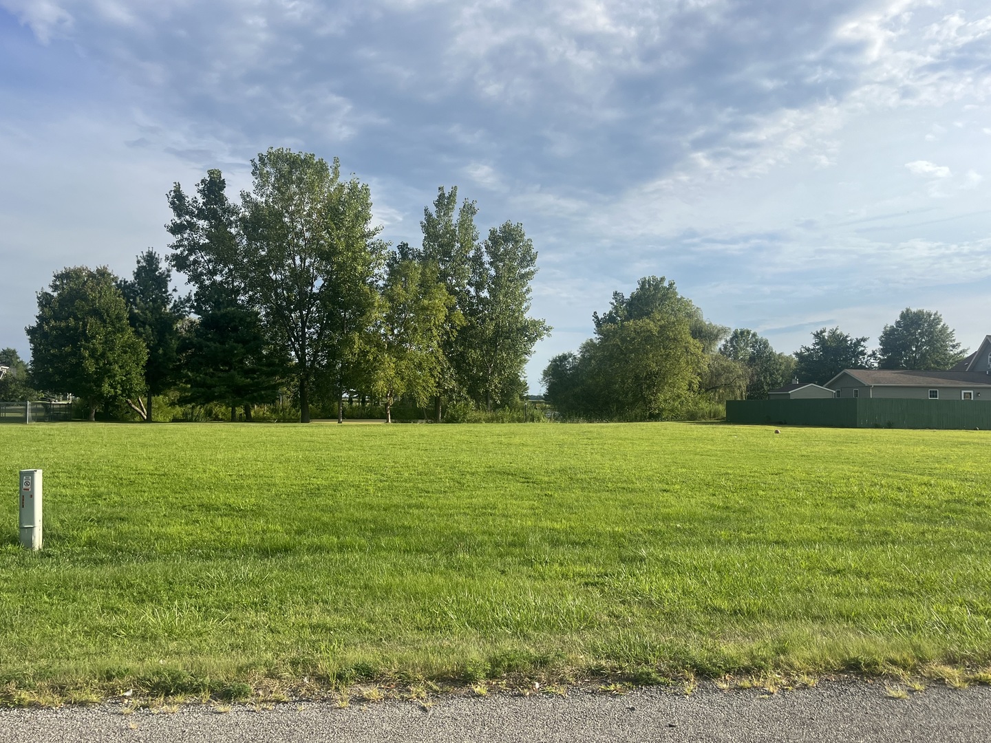 a view of a field with an ocean