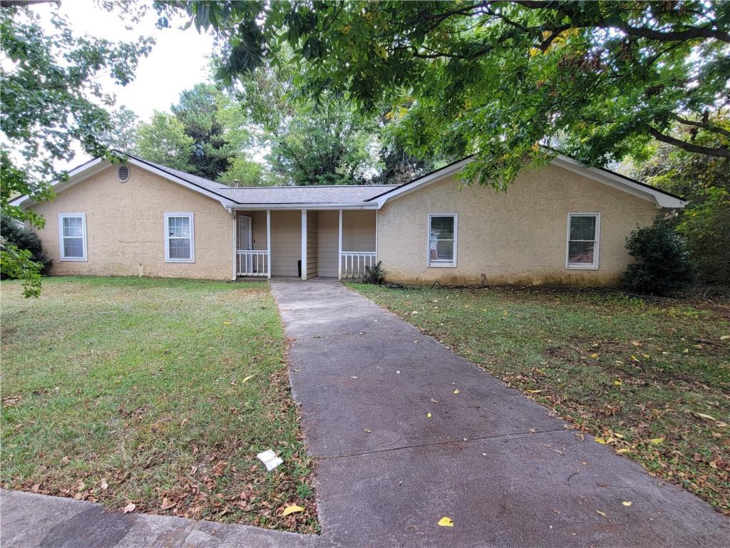 a house with a tree in front of it