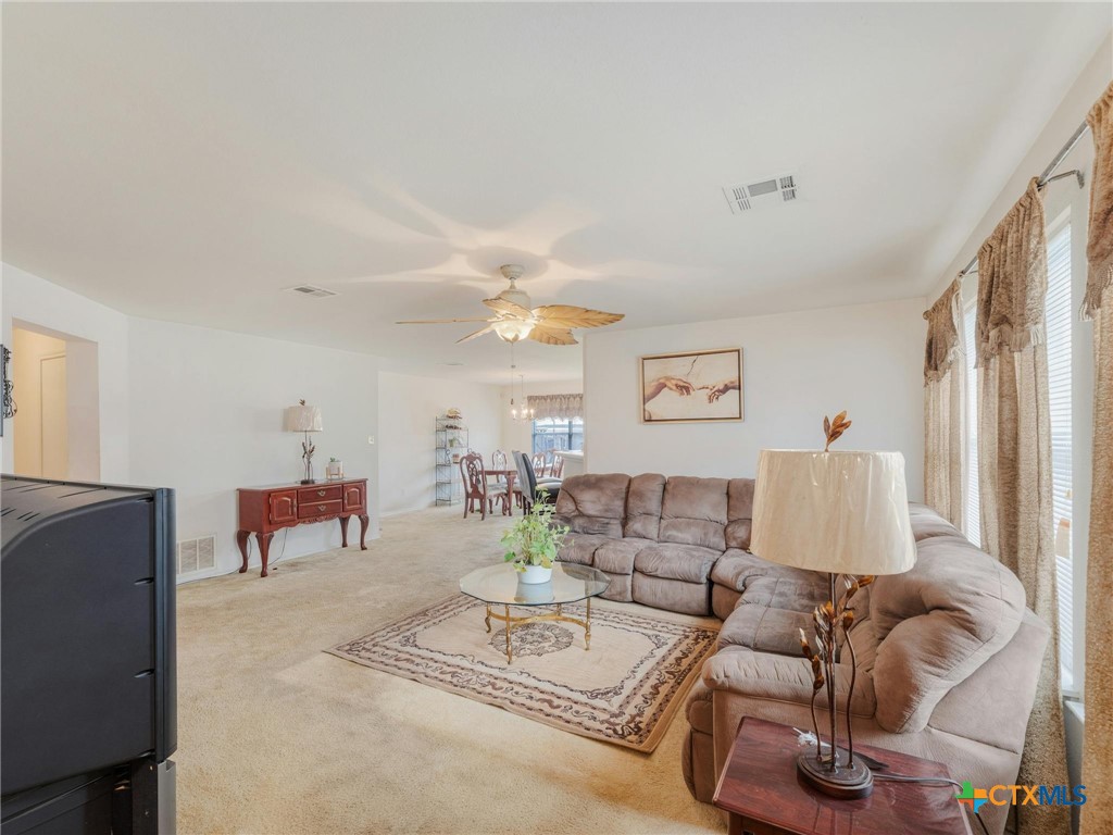 a living room with furniture and a table