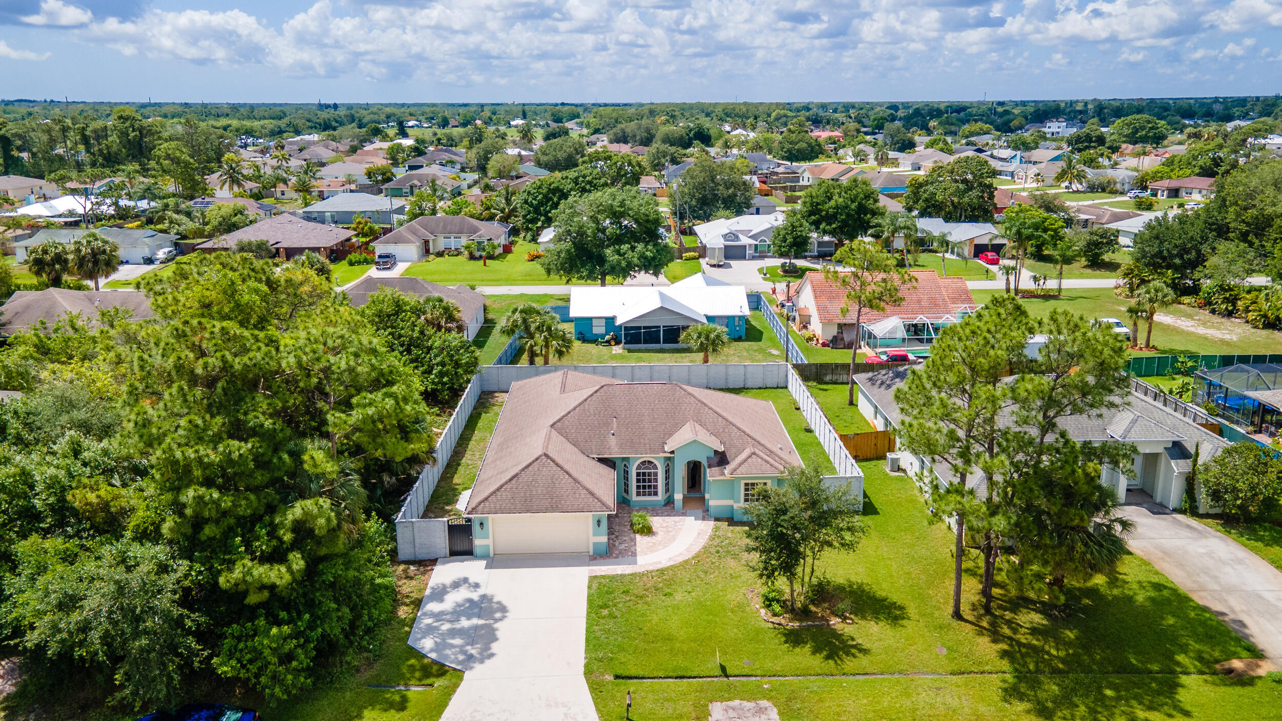 an aerial view of a house with a garden