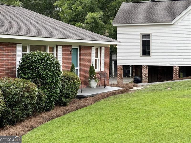 a front view of a house with a yard and porch