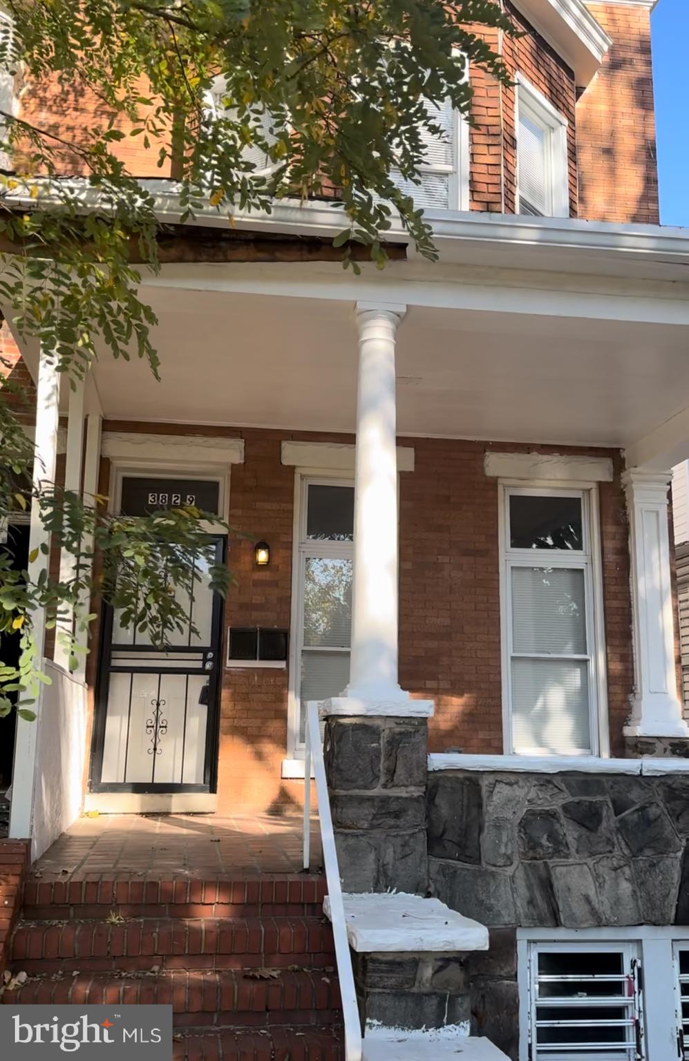 a view of a building with a porch