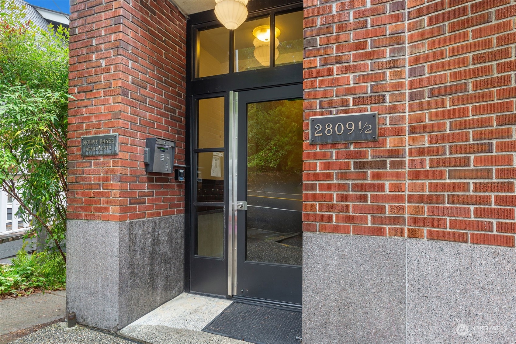 a brick building with a window and door