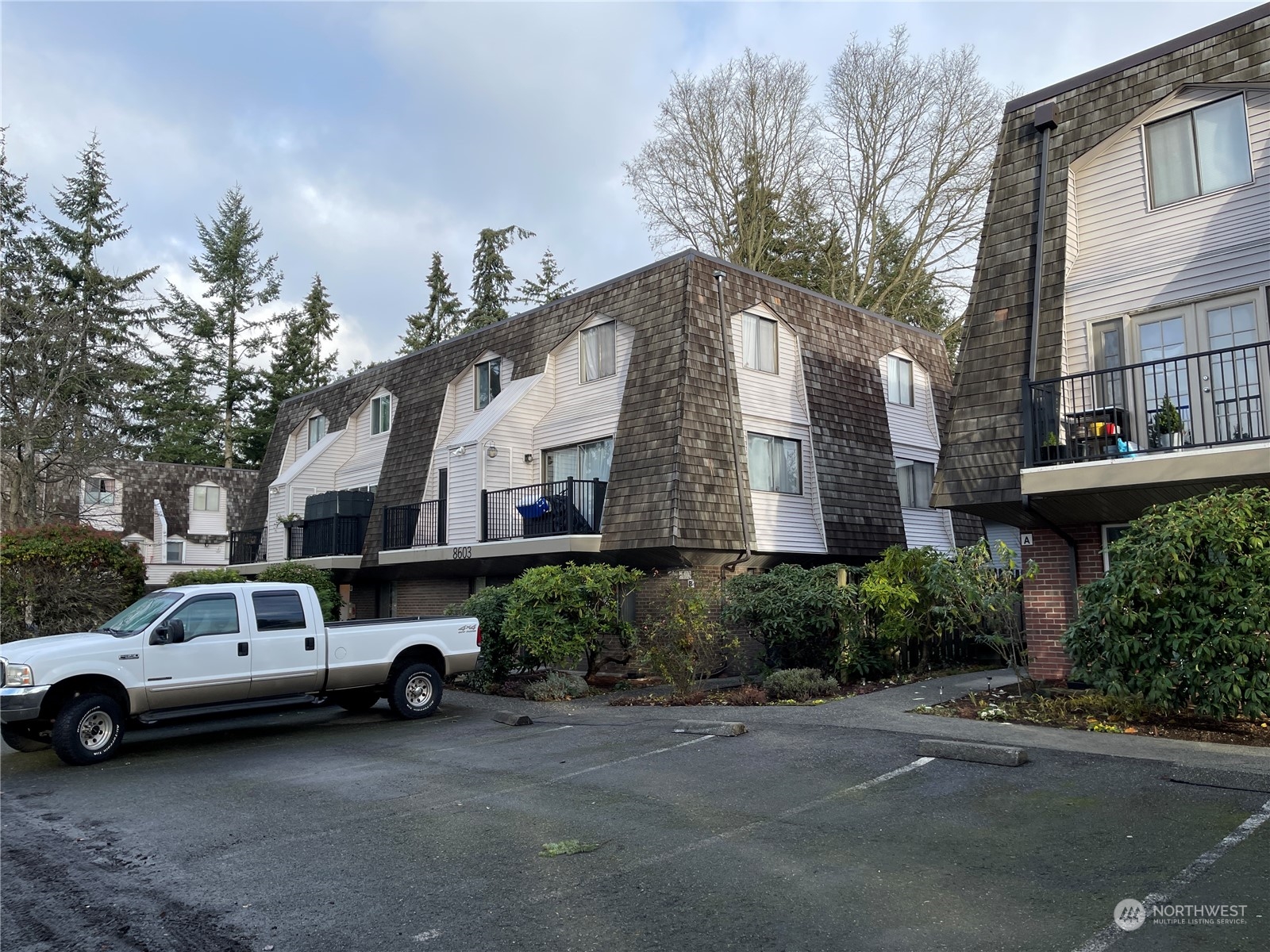 a view of a cars parked in front of a house