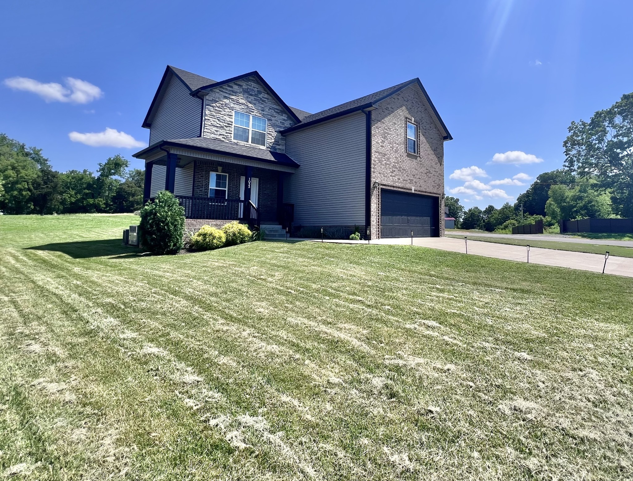 a front view of a house with a yard