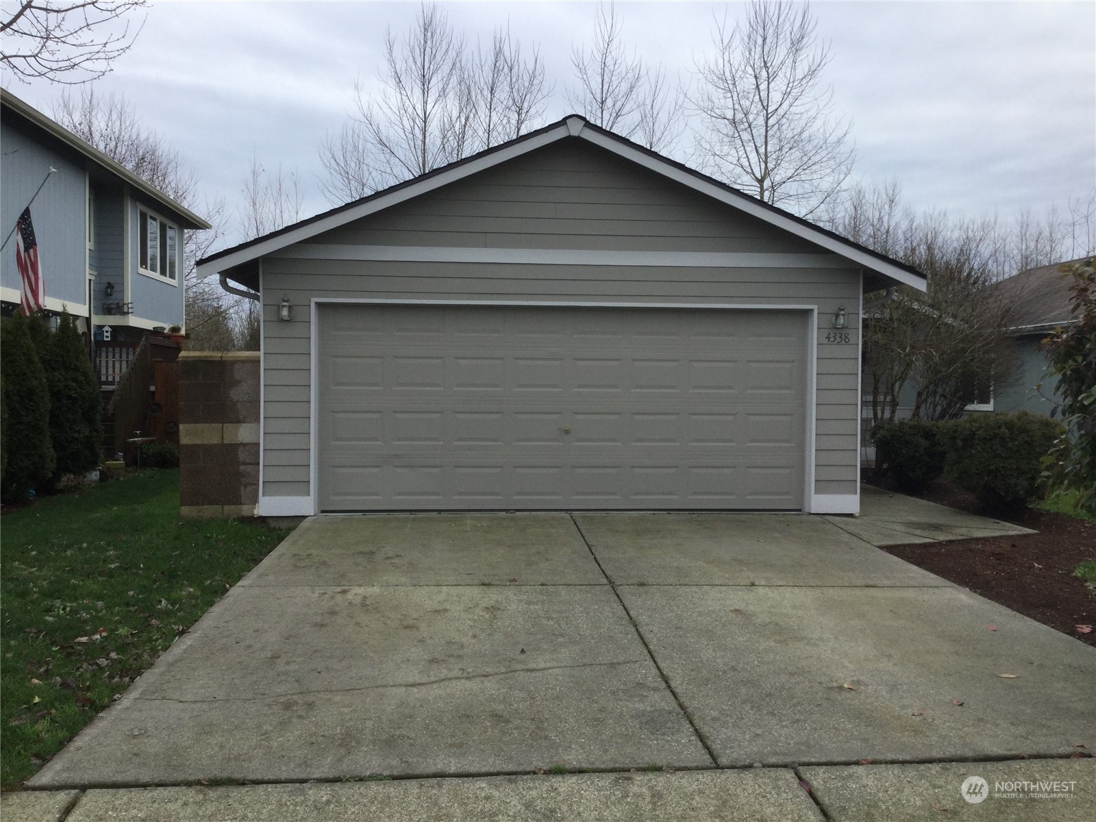 a front view of a house with garage