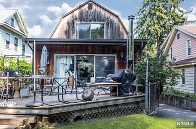 a view of house with patio and garden