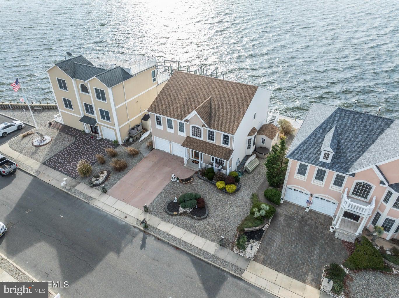 an aerial view of residential house with outdoor space and parking