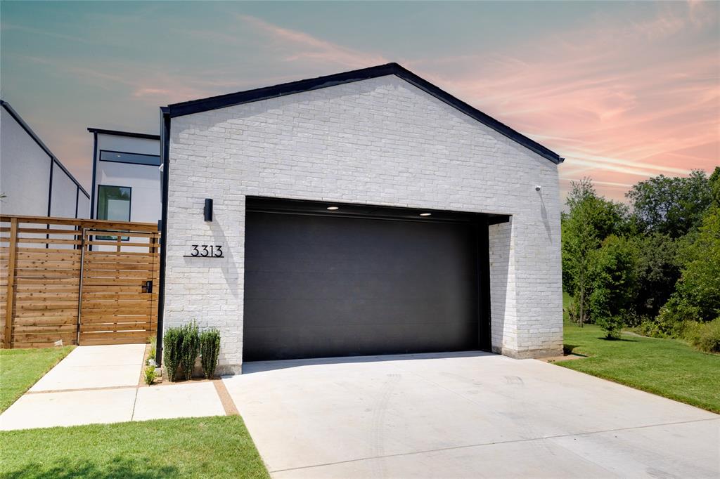 a front view of a house with garage