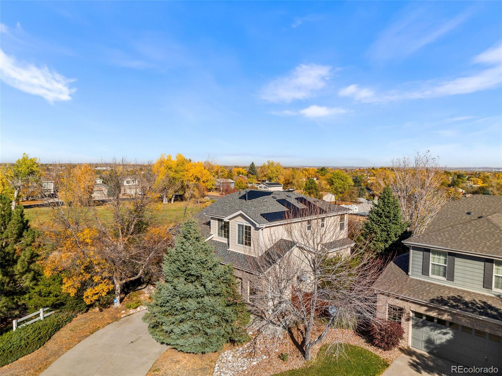 aerial view of a house with a yard