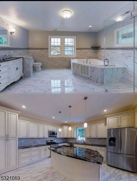 a large kitchen with a large counter top appliances and cabinets