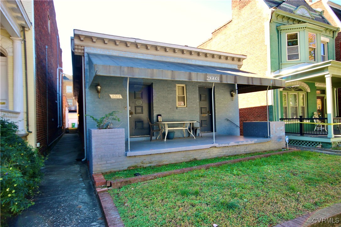 a view of a patio with table and chairs and potted plants