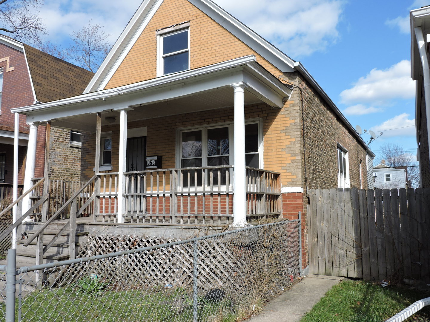 a front view of a house with a fence