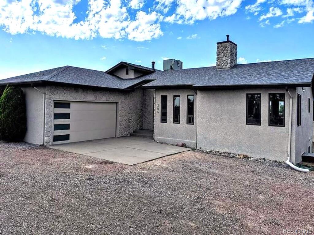 a house that has a tree in front of it