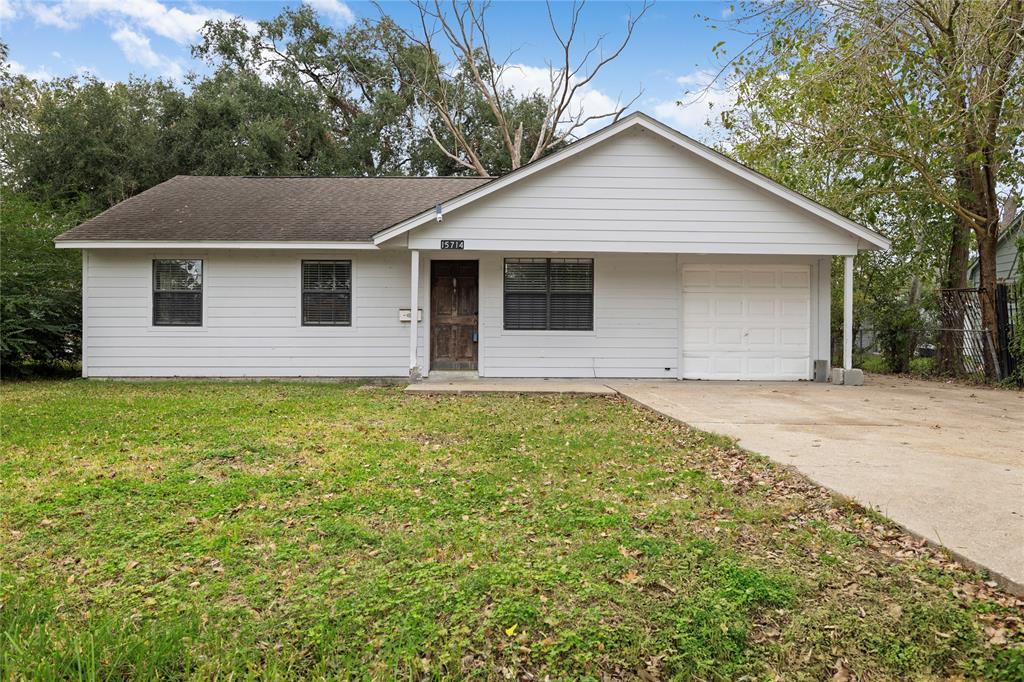 a front view of a house with yard