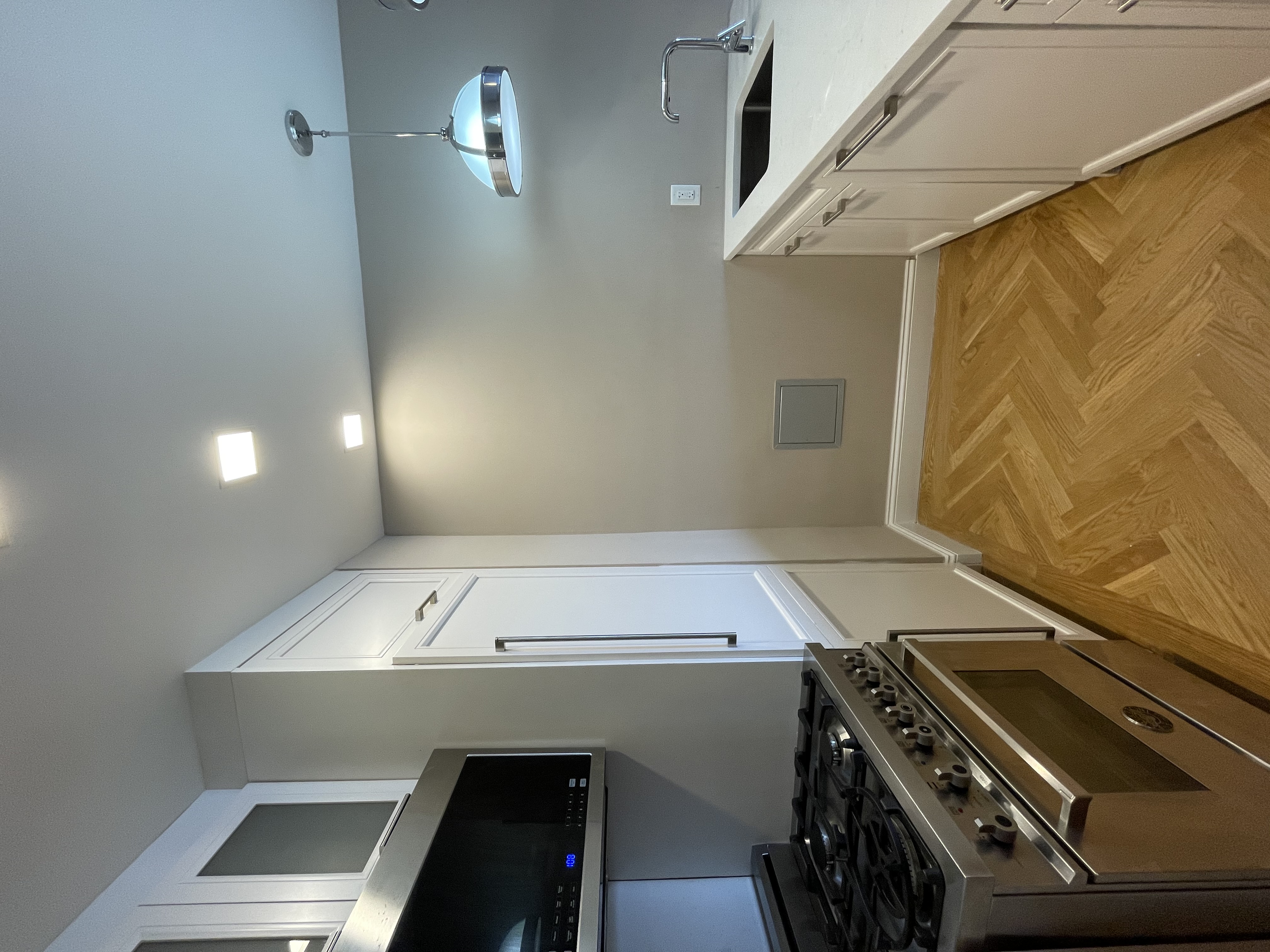 a kitchen with a stove and a sink