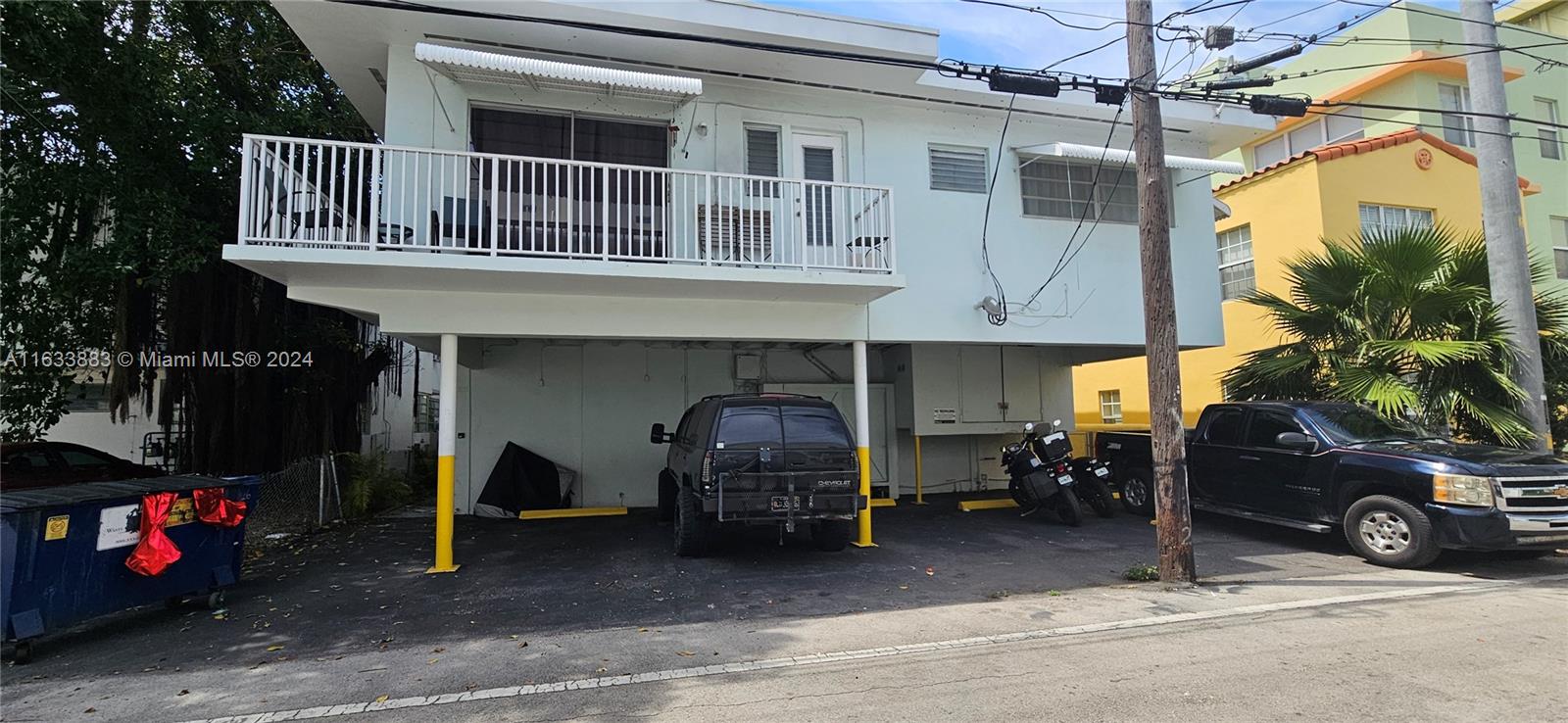 a view of a car park in front of house