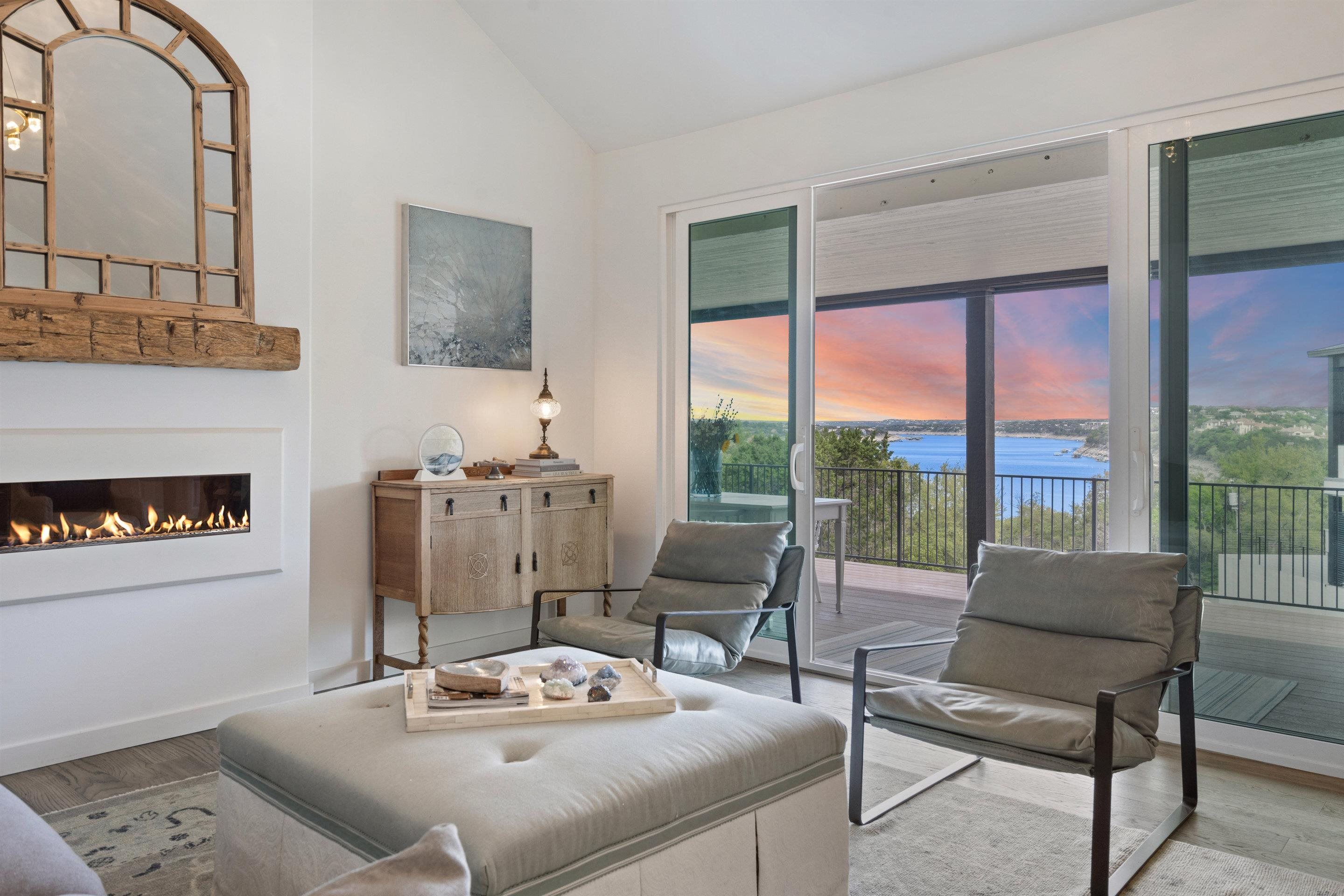 a living room with furniture and a floor to ceiling window