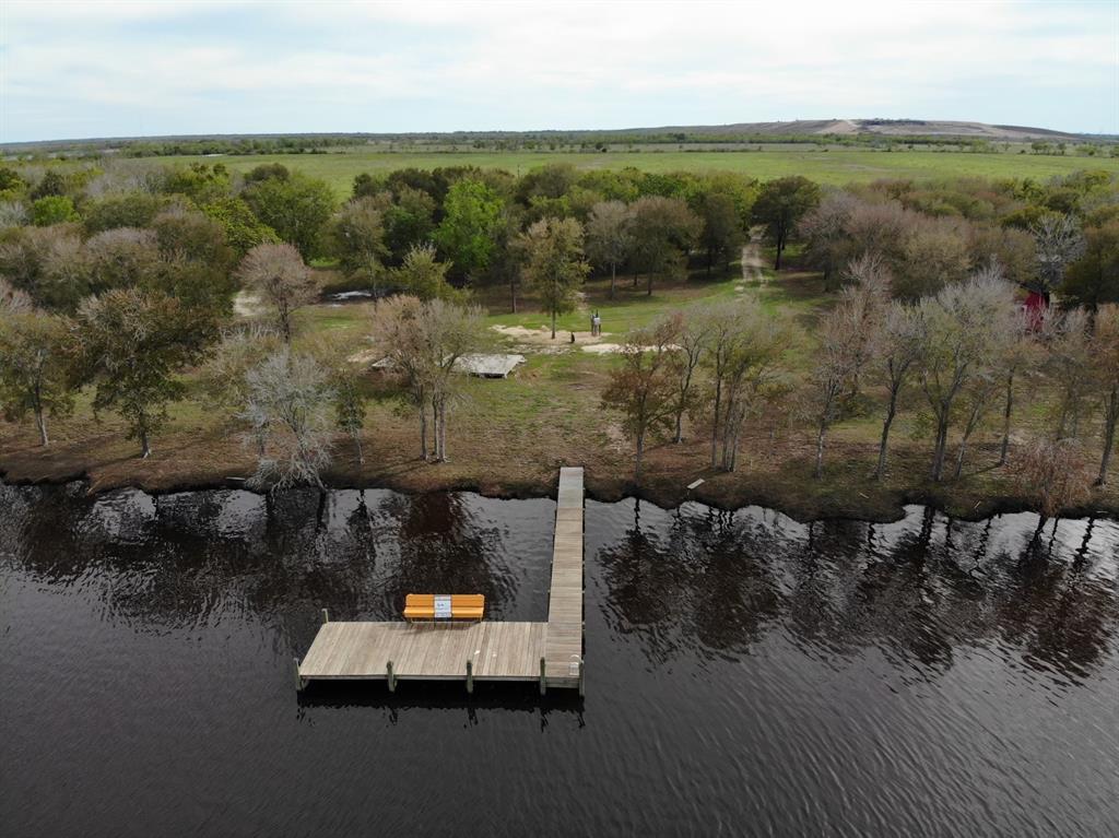 Amazing view of the water, pier, and land.