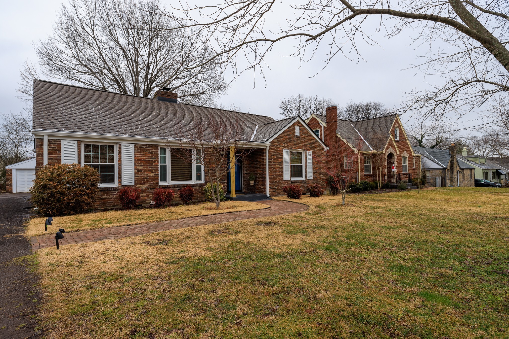 a view of a yard in front view of a house