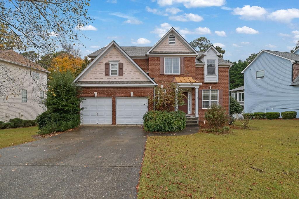 front view of a house with a yard