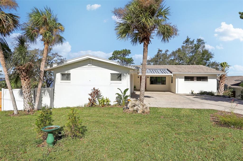 a front view of house with yard and seating area