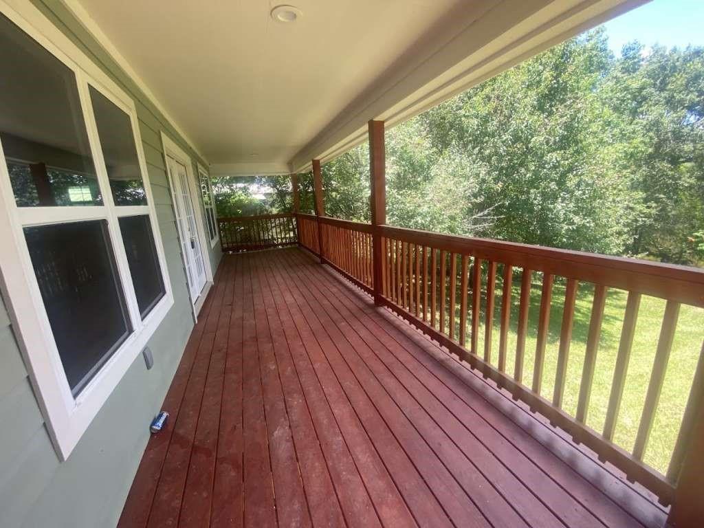 a view of balcony with wooden floor