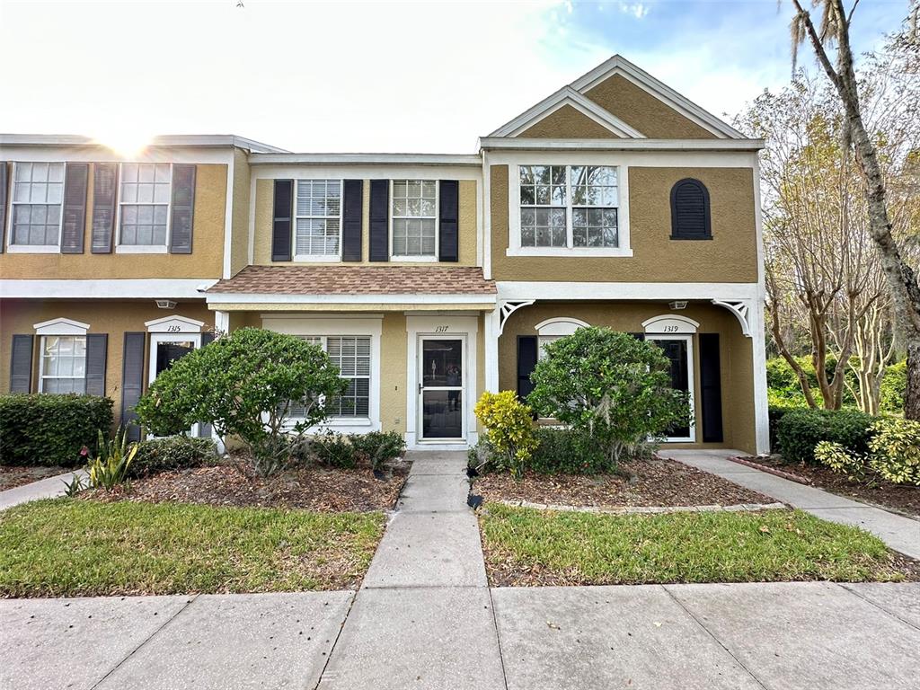 a front view of a house with garden