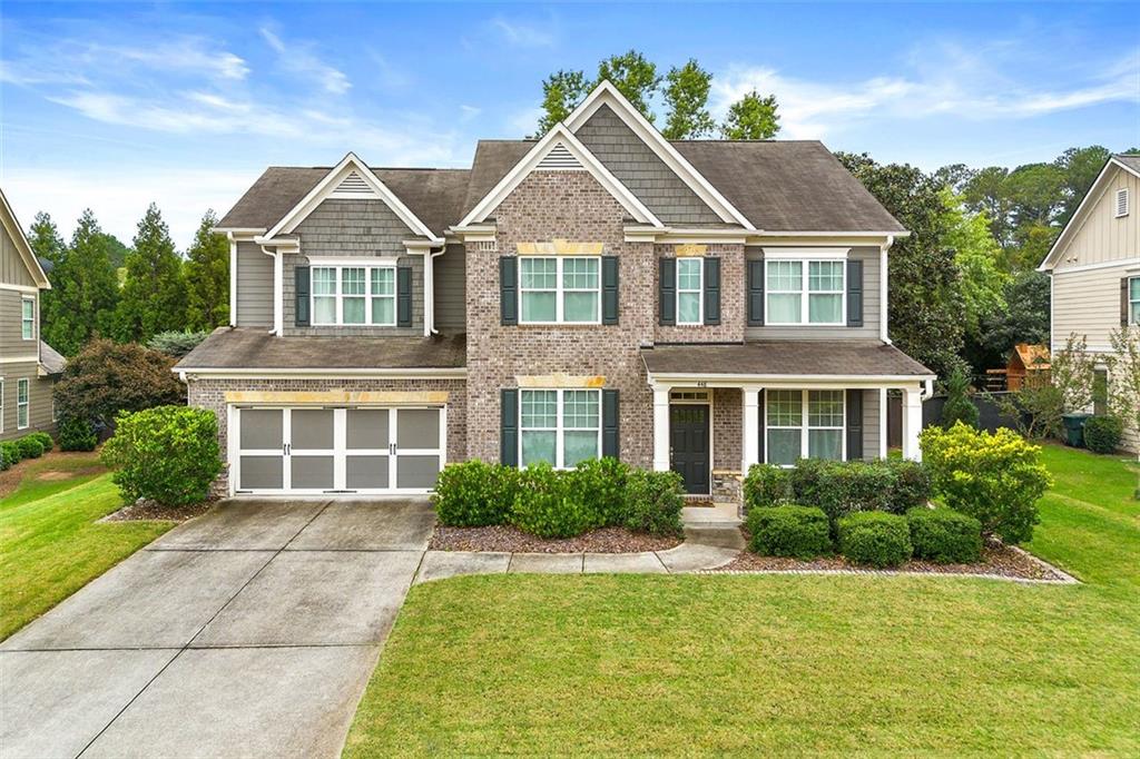 a front view of a house with garden