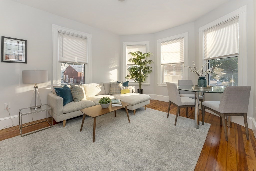 a living room with furniture and a table