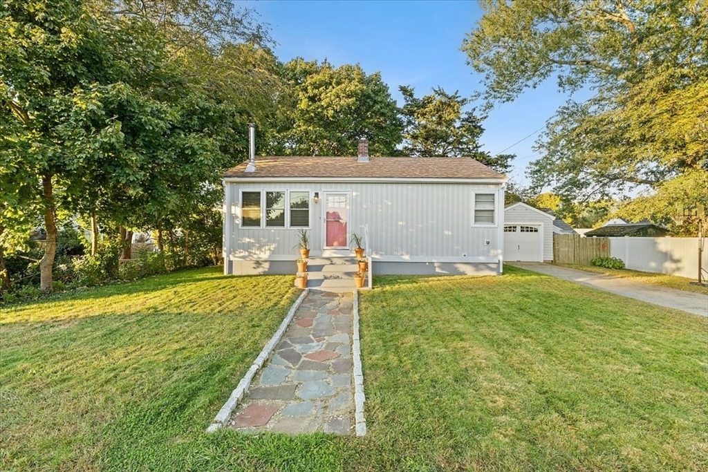 front view of a house with a yard