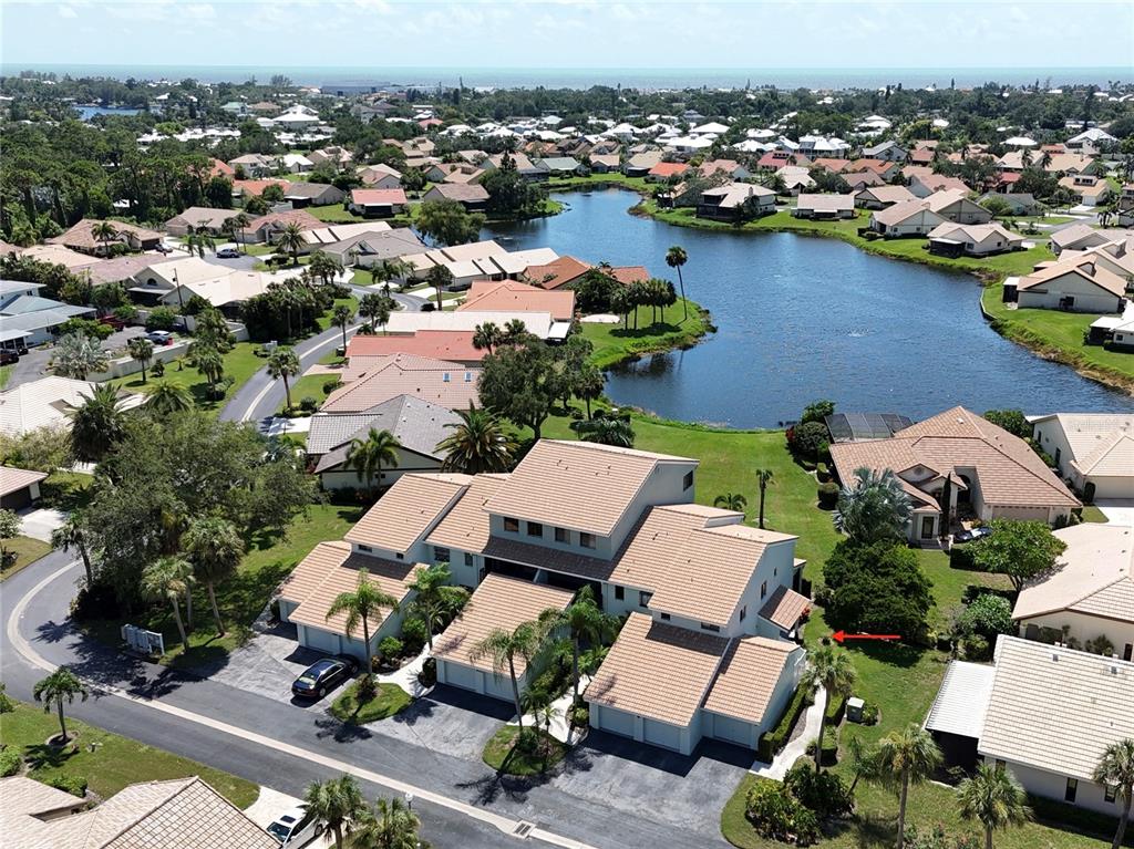 an aerial view of a house with a lake view