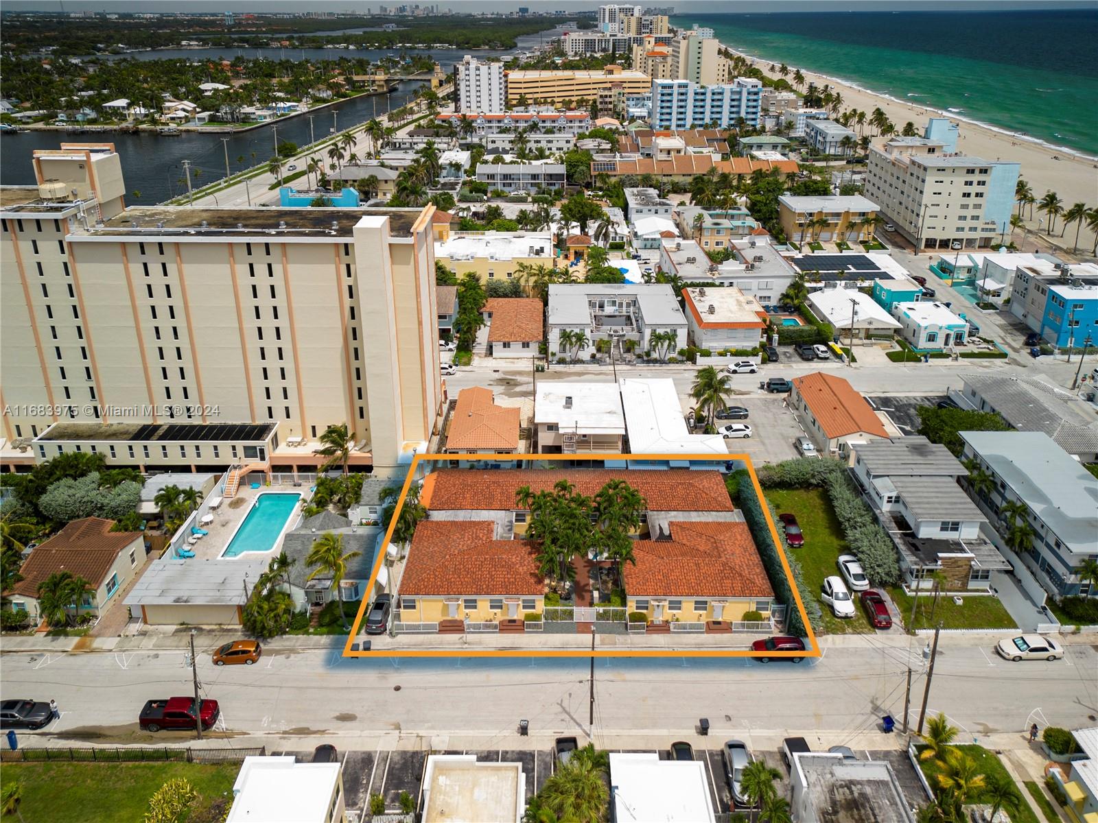 an aerial view of residential houses and outdoor space