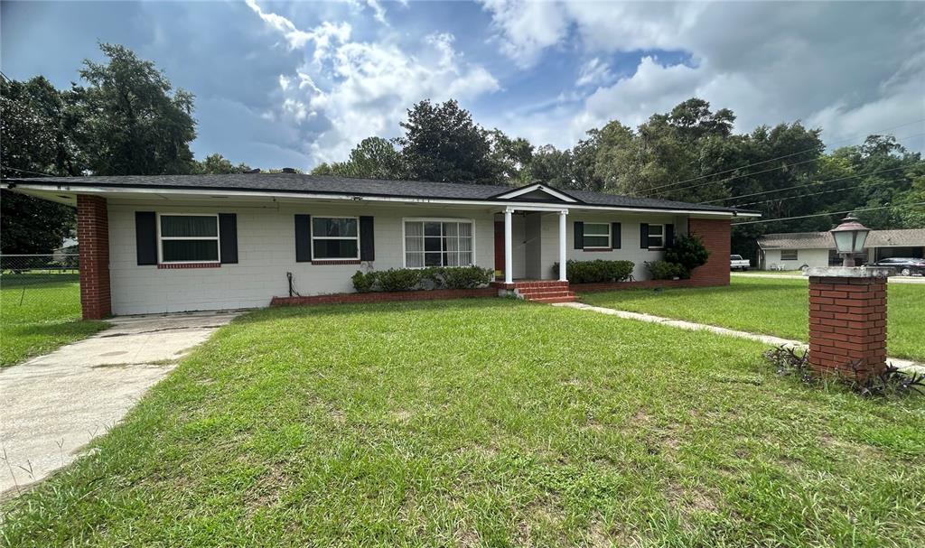 Exterior Front showing front driveway, front porch and entry door.