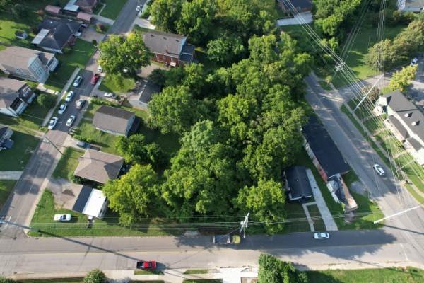 an aerial view of residential houses with outdoor space