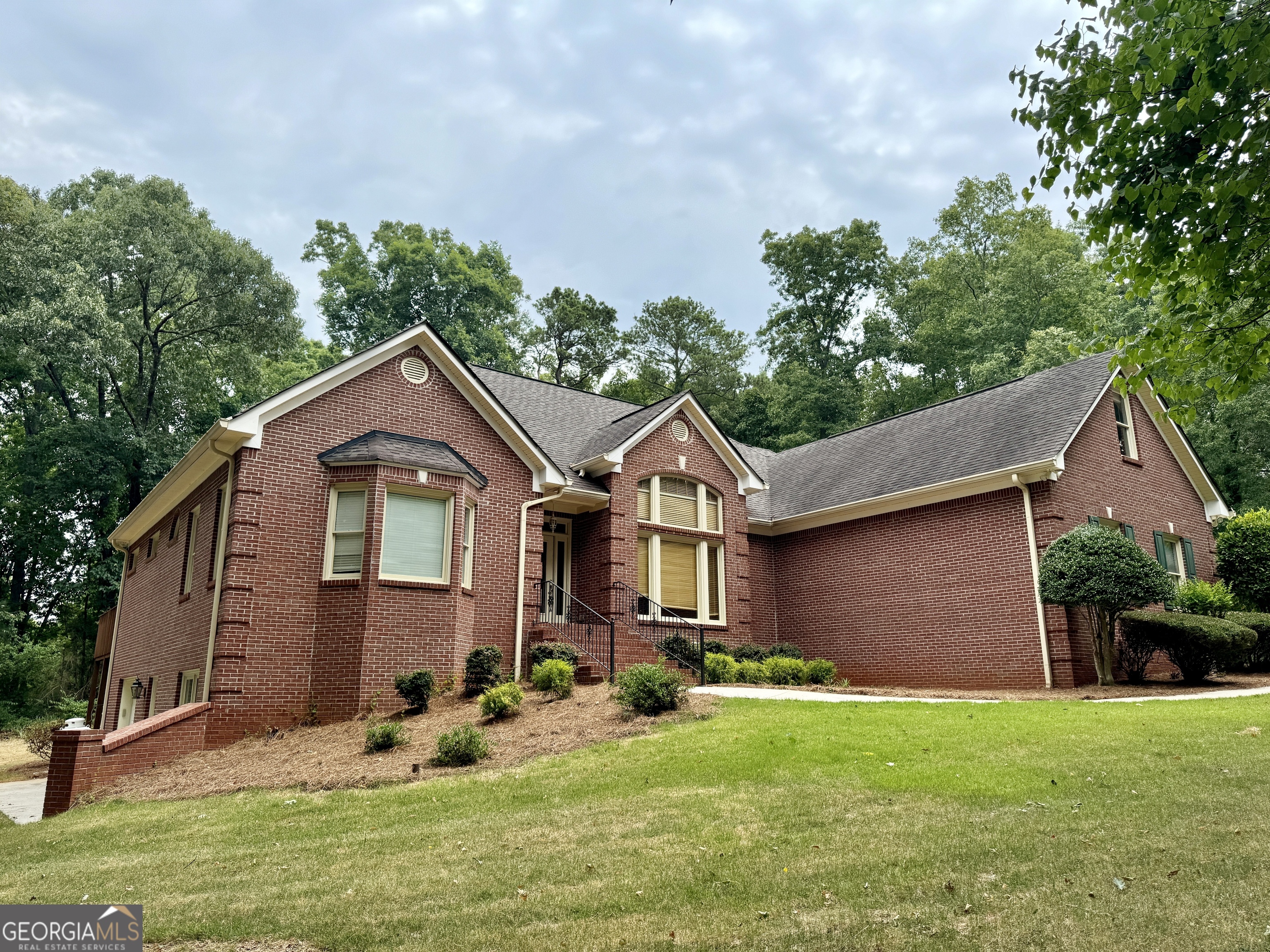 front view of a house with a yard