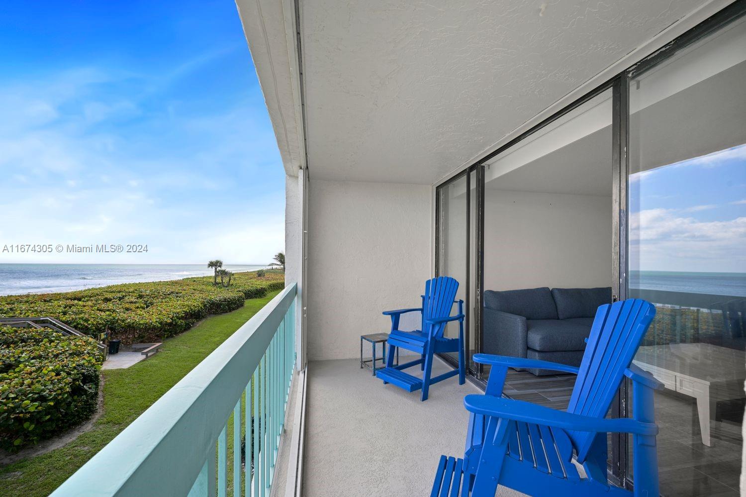 a view of balcony with outdoor seating and city view